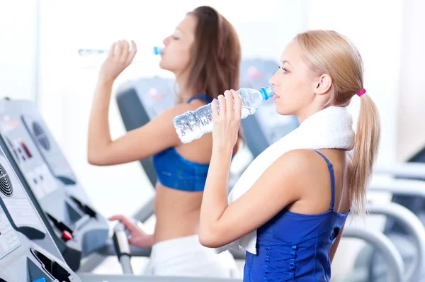 Women drinking water after sports — Stock Photo, Image