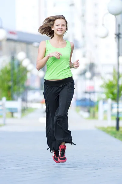 Woman jogging in city street park — Stock Photo, Image