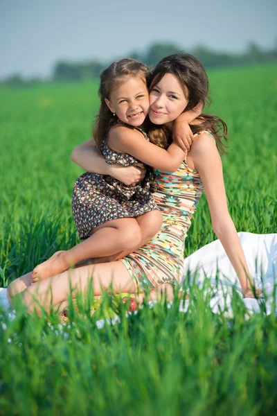 Happy girls on green grass — Stock Photo, Image