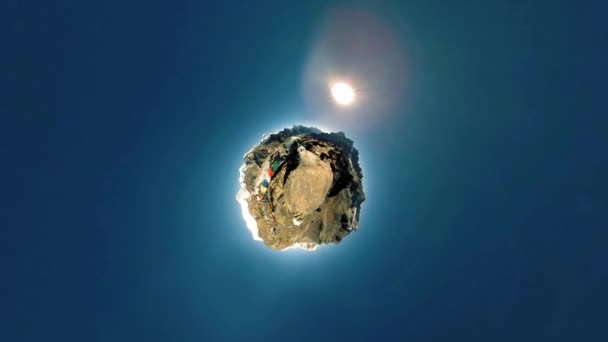 360 VR Gokyo Ri mountain top. Tibetan prayer Buddhist flag. Wild Himalayas high altitude nature and mount valley. Rocky slopes covered with ice. Tiny planet transformation. — Stock Video