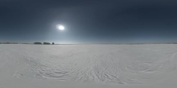 360 VR drone aerial view of cold winter landscape arctic field, trees covered with frost snow, ice river and sun rays over horizon. Extreme low temperature weather. Low altitude fast horizontal — Stock Video