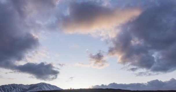 Timelapse of epic clouds at mountain medow at autumn time. Wild endless nature with snow storm sky. Fast movement — Stock Video