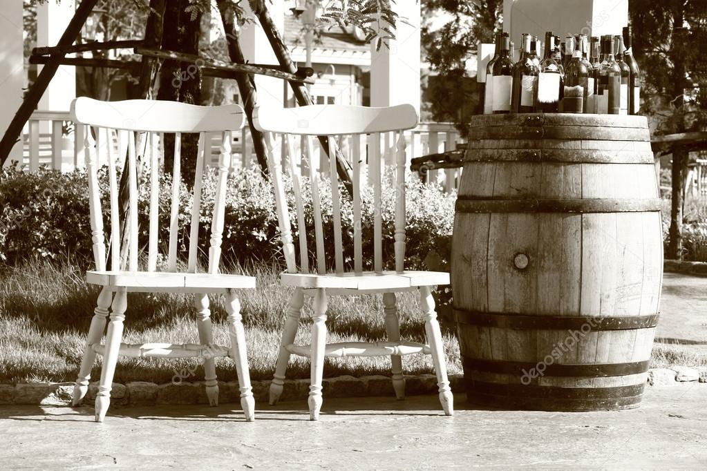 Relaxing chairs with vine bottles