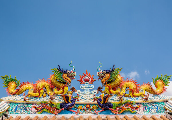 Double dragon on chinese temple roof, pakchong, thailand