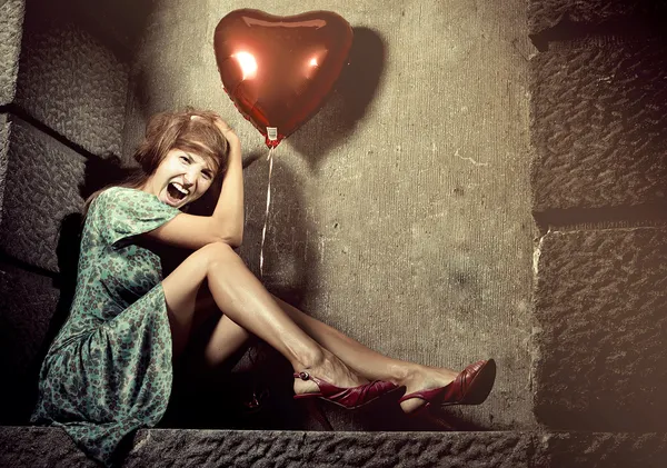 Young woman with a balloon — Stock Photo, Image