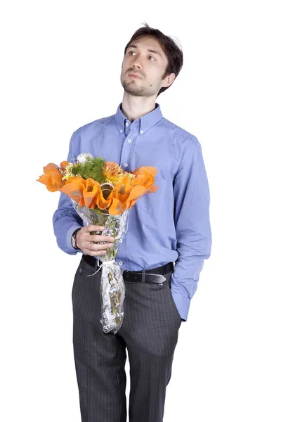 Portrait of a manwith flowers in the studio — Stock Photo, Image