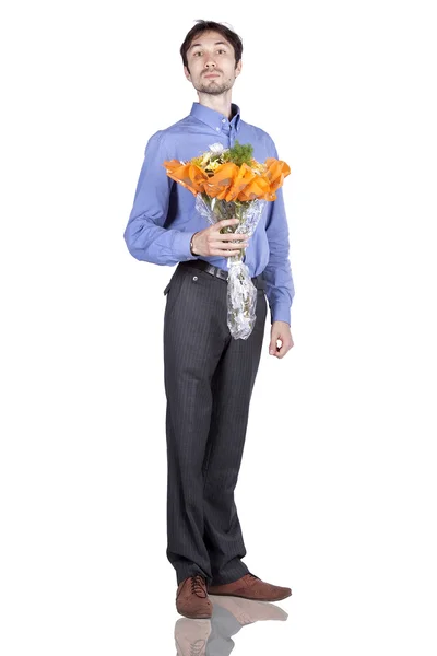 Portrait of a manwith flowers in the studio — Stock Photo, Image