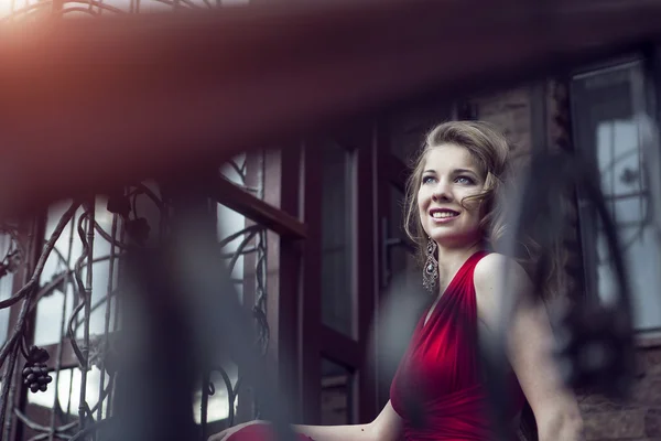 Pretty young woman in red dress — Stock Photo, Image