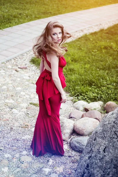 Pretty young woman in red dress — Stock Photo, Image