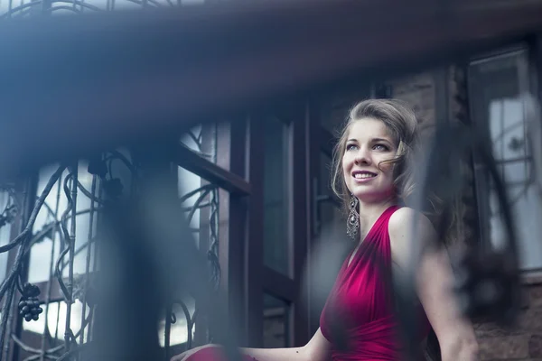 Pretty young woman in red dress — Stock Photo, Image