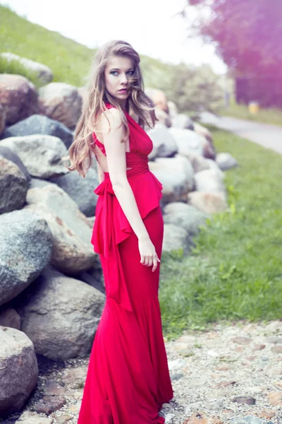 Pretty young woman in red dress — Stock Photo, Image