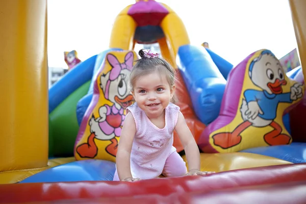 Child playing on a inflatable castle — Stock Photo, Image