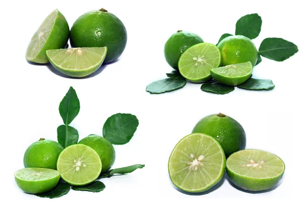 Limes met segmenten en bladeren — Stockfoto
