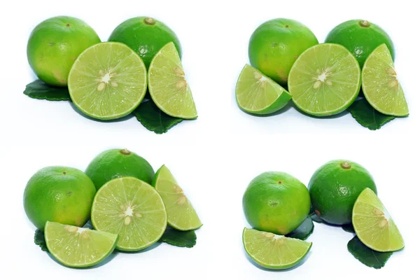 Limes with slices and leaves — Stock Photo, Image