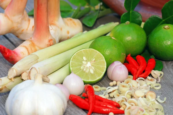 Limes with slices and leaves Stock Picture