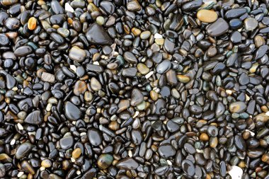 Stack of colorful pebbles at Koh Hin Ngam, Satun province Thailand. clipart