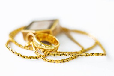 shiny gold and shiny gold Jewelry on table