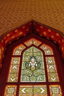 Beautiful sculptures depicting angels on the doors of Thai temples.