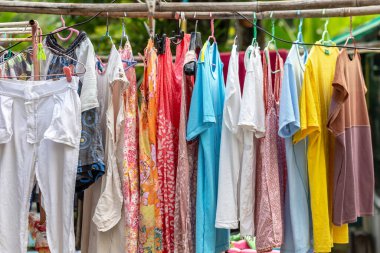 The washed clothes are placed in the sun to dry.