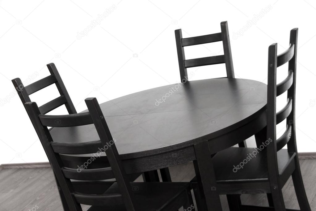 Brown round table against white wall
