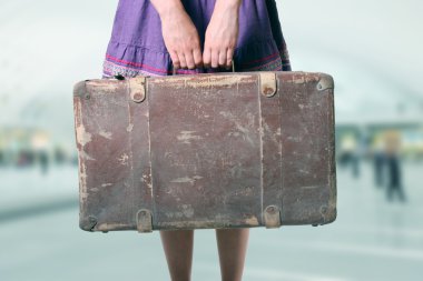 woman with luggage at the airport clipart