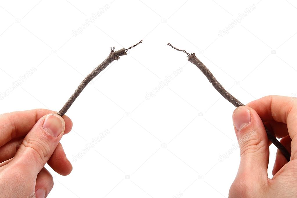 two bare electric wires in the hands