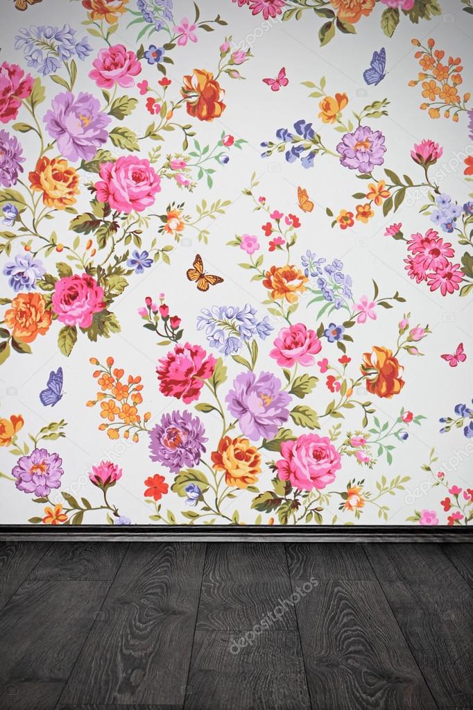 vintage room with floral colorful wallpaper and wooden floor