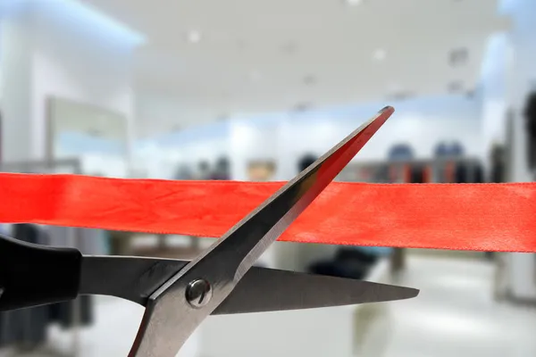 Shop grand opening - cutting red ribbon — Stock Photo, Image