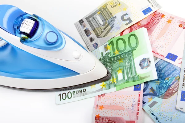 Planchado de dinero en euros —  Fotos de Stock