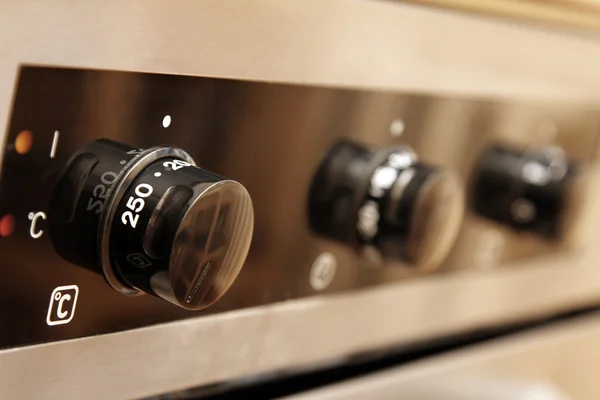 Close up of controls from a modern stainless steel oven — Stock Photo, Image