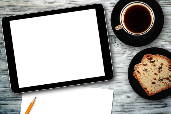 Arbeitsplatz mit digitalem Tablet, Notizbuch, Kuchen und Kaffeetasse — Stockfoto