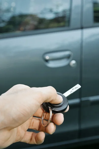 Hand holding remote control car key — Stock Photo, Image