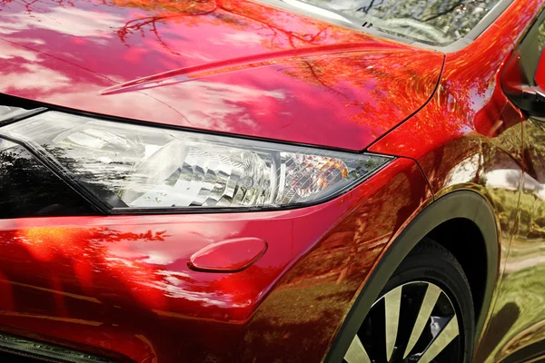 Closeup of modern red sport car headlight — Stock Photo, Image