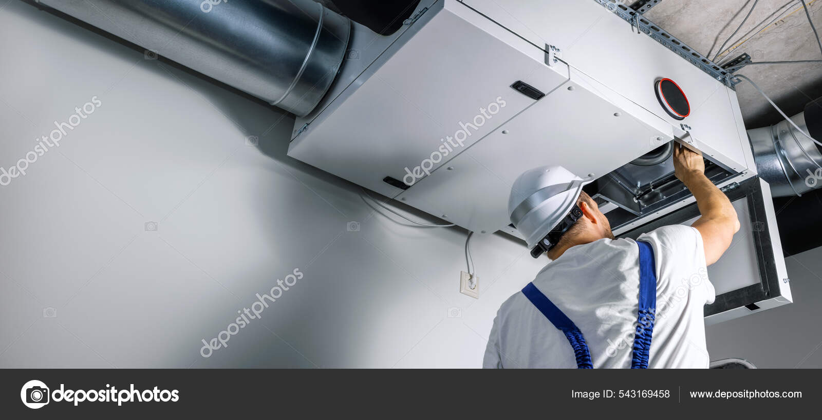 Hvac Engineer Install Heat Recovery Ventilation System New House Copy Stock Photo by ©ronstik