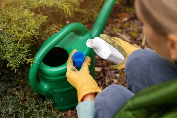 Woman Pours Liquid Mineral Fertilizer Watering Can Garden Plants — стоковое фото