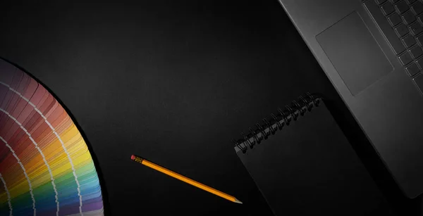 Designer Workspace Color Swatch Laptop Notepad Black Background Banner Copy — Stockfoto