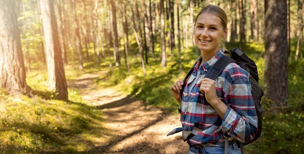Smiling Young Woman Checkered Shirt Backpack Standing Forest Trail Nature — 图库照片