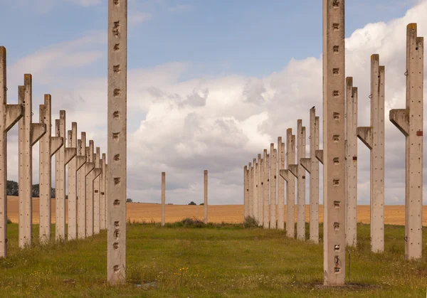 Pillars out of cement are standing in the countryside — Stock Photo, Image