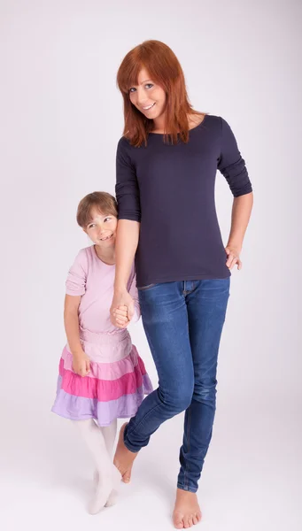 Mother and daughter together in front of a camera — Stock Photo, Image