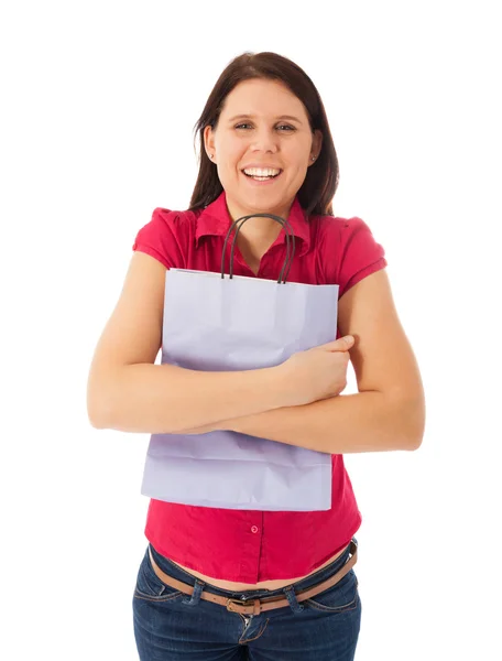 A happy young girl is holding a shopping bag — Stock Photo, Image