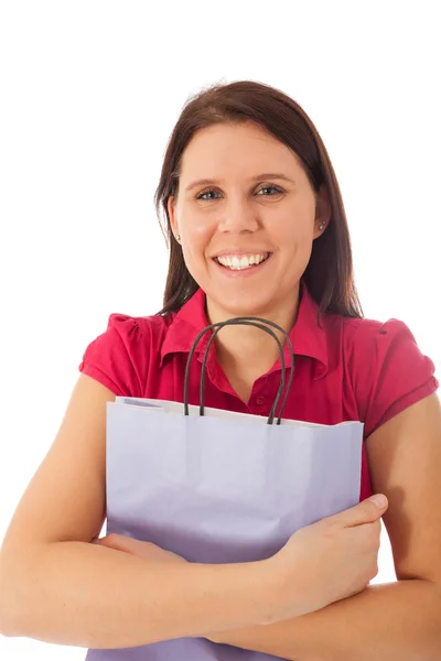 Una joven feliz sostiene una bolsa de compras —  Fotos de Stock