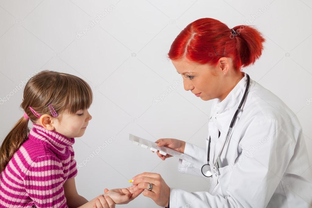 The pediatrician gives her patient a tablet