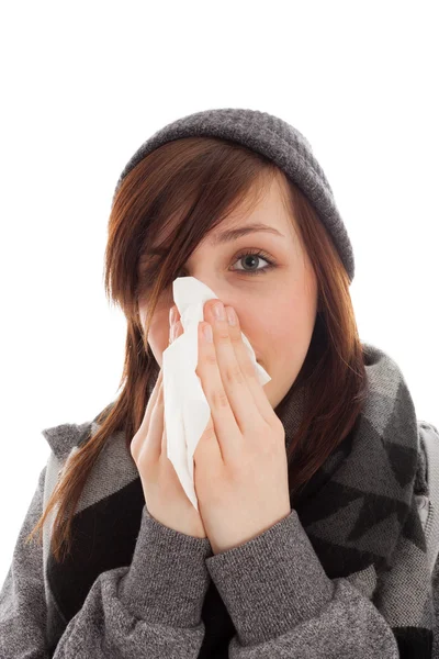 The young girl is blowing her nose — Stock Photo, Image