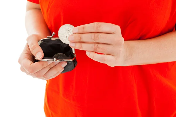 The young woman has a coin in the hands — Stock Photo, Image