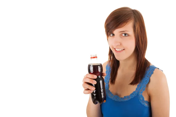 The young woman is drinking from a plastic bottle — Stock Photo, Image