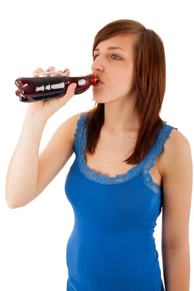 The young woman is drinking from a plastic bottle — Stock Photo, Image