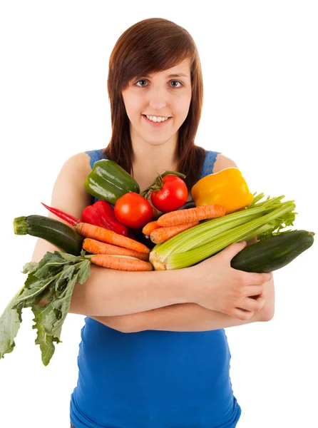 La jeune femme avec son bras plein de légumes — Photo