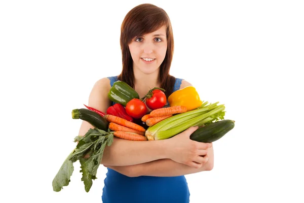 La jeune femme avec son bras plein de légumes — Photo