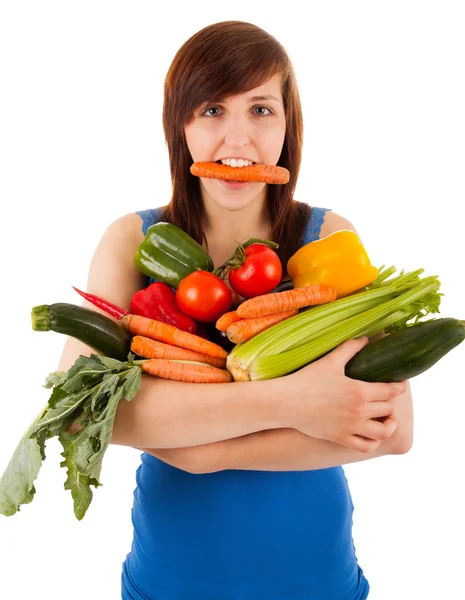 La jeune femme avec son bras plein de légumes — Photo