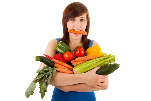 A jovem com o braço cheio de vegetais — Fotografia de Stock